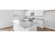 A kitchen showcasing granite countertops, an island, white cabinets, and stainless steel appliances at 181 Morning View Way, Moncks Corner, SC 29461