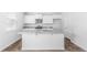 A kitchen featuring an island, modern appliances, granite countertops, and white cabinetry at 181 Morning View Way, Moncks Corner, SC 29461