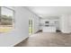 Spacious living room with luxury vinyl flooring, natural light, and an open kitchen floorplan at 181 Morning View Way, Moncks Corner, SC 29461