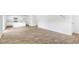 Spacious living area featuring wood-look floors and an open floorplan leading to the kitchen at 181 Morning View Way, Moncks Corner, SC 29461