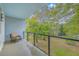 Spacious balcony showing the outdoor chair and green landscape, providing a serene escape with natural beauty at 1816 Orangeburg St, North Charleston, SC 29405
