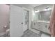 Bright bathroom features a double vanity, patterned tile floors, and an adjacent toilet room for added convenience at 1816 Orangeburg St, North Charleston, SC 29405
