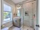 Modern bathroom showcasing a glass shower, vanity, and a window offering natural light at 1816 Orangeburg St, North Charleston, SC 29405