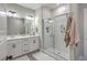 Stylish bathroom with double vanities, sleek lighting fixtures, and a glass-enclosed shower offering a spa-like experience at 1816 Orangeburg St, North Charleston, SC 29405