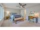 Comfortable bedroom featuring neutral walls, carpet, a ceiling fan, and a classic work desk at 1816 Orangeburg St, North Charleston, SC 29405