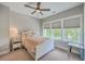 Comfortable bedroom featuring a ceiling fan, neutral color palette, and a large window for ample natural light at 1816 Orangeburg St, North Charleston, SC 29405