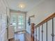 Welcoming foyer with hardwood floors, staircase, coat rack, and a front door with glass panels at 1816 Orangeburg St, North Charleston, SC 29405