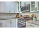 Gourmet kitchen features stainless steel appliances and white cabinets at 1816 Orangeburg St, North Charleston, SC 29405