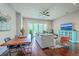 Inviting living area features a sliding glass door, stylish furnishings, and beautiful hardwood floors at 1816 Orangeburg St, North Charleston, SC 29405