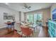 Open-concept living and dining area with hardwood floors and abundant natural light at 1816 Orangeburg St, North Charleston, SC 29405