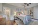 Comfortable bedroom features a metal bed frame, bedside table, and a view into the main bathroom, creating a private retreat at 1816 Orangeburg St, North Charleston, SC 29405