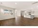 Bright kitchen with gray cabinets, stainless steel appliances, quartz counters, and an island with a sink and seating at 1824 Nola Run, Summerville, SC 29485