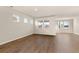Bright and airy living room with beautiful wood floors and multiple windows offering plenty of natural light at 1824 Nola Run, Summerville, SC 29485