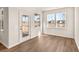 Cozy living room featuring lots of natural light, wood floors, and serene views at 1824 Nola Run, Summerville, SC 29485