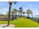 Backyard with manicured lawn, mature landscaping, and a water view at 1954 Sandy Point Ln, Mount Pleasant, SC 29466