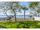 Waterfront backyard with synthetic grass and a view of the pier at 1954 Sandy Point Ln, Mount Pleasant, SC 29466
