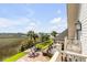 Amazing marsh view with palm trees and manicured lawn from upper balcony of home at 1954 Sandy Point Ln, Mount Pleasant, SC 29466
