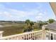 Stunning marsh view from balcony, showcasing lush landscaping and serene atmosphere at 1954 Sandy Point Ln, Mount Pleasant, SC 29466
