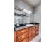 Stylish bathroom features a dark vanity top, wood cabinets, modern lighting, and a glass-enclosed shower with decorative tile at 1954 Sandy Point Ln, Mount Pleasant, SC 29466