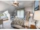 Charming bedroom with a window seat, sitting area, a plush bed and hardwood floors at 1954 Sandy Point Ln, Mount Pleasant, SC 29466