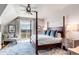 Lovely bedroom with seating area and view of the marsh from a private balcony at 1954 Sandy Point Ln, Mount Pleasant, SC 29466