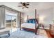 Lovely bedroom with seating area, hardwood floors, ceiling fan and view of the marsh at 1954 Sandy Point Ln, Mount Pleasant, SC 29466