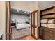 A beautifully staged bedroom showcasing an open doorway, hardwood floors, and a coordinated color scheme at 1954 Sandy Point Ln, Mount Pleasant, SC 29466
