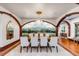 Beautiful dining room with hardwood floors, decorative mural, chandelier, and seating for eight at 1954 Sandy Point Ln, Mount Pleasant, SC 29466
