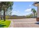 Spacious brick driveway with palm tree, creating a welcoming entrance to the home at 1954 Sandy Point Ln, Mount Pleasant, SC 29466