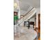Inviting foyer featuring a staircase, piano, marble floors, and elegant woodwork at 1954 Sandy Point Ln, Mount Pleasant, SC 29466