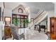 Elegant foyer with high ceilings, marble floors, staircase, and a classic piano at 1954 Sandy Point Ln, Mount Pleasant, SC 29466