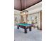 Game room has a pool table, bright lighting and water views at 1954 Sandy Point Ln, Mount Pleasant, SC 29466