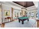 Game room with pool table, water view, and elegant decor at 1954 Sandy Point Ln, Mount Pleasant, SC 29466