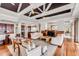 Spacious living room with exposed ceiling beams, wood floors, and cherry wood cabinetry at 1954 Sandy Point Ln, Mount Pleasant, SC 29466