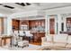 Cozy living room featuring white furnishings, cherry wood cabinets, and access to the kitchen at 1954 Sandy Point Ln, Mount Pleasant, SC 29466