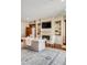 Living room with fireplace, TV, hardwood floors, and built-in bookshelves at 1954 Sandy Point Ln, Mount Pleasant, SC 29466