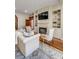 Living room with fireplace, TV, hardwood floors, and built-in bookshelves at 1954 Sandy Point Ln, Mount Pleasant, SC 29466