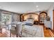 Comfortable main bedroom with hardwood floors, seating area, recessed lighting, and backyard access at 1954 Sandy Point Ln, Mount Pleasant, SC 29466