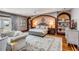 Comfortable main bedroom with hardwood floors, seating area, recessed lighting, and backyard access at 1954 Sandy Point Ln, Mount Pleasant, SC 29466