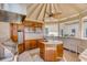 Well-equipped outdoor kitchen with wooden cabinetry, perfect for al fresco dining and entertaining at 1954 Sandy Point Ln, Mount Pleasant, SC 29466