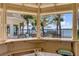 Outdoor bar area with seating overlooking the water, perfect for enjoying drinks and sunsets at 1954 Sandy Point Ln, Mount Pleasant, SC 29466