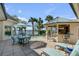 Outdoor dining area with pool and bar nearby, creating an ideal space for entertaining and relaxation at 1954 Sandy Point Ln, Mount Pleasant, SC 29466