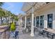 Back patio with tables and seating overlooking a waterway at 1954 Sandy Point Ln, Mount Pleasant, SC 29466