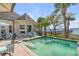 Inviting pool with waterfront views, surrounded by comfortable seating for outdoor entertaining at 1954 Sandy Point Ln, Mount Pleasant, SC 29466