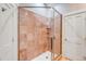 Luxurious shower with glass door and decorative marble design in remodeled bathroom at 1954 Sandy Point Ln, Mount Pleasant, SC 29466