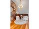 Comfortable sitting area showcasing a spiral staircase, built-in bookshelves, and an inviting atmosphere at 1954 Sandy Point Ln, Mount Pleasant, SC 29466