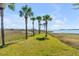 Waterfront property featuring a grassy lawn with a view of a large body of water at 1954 Sandy Point Ln, Mount Pleasant, SC 29466