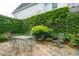 Seating area with flagstone patio and lush green foliage in backyard at 21 Rutledge Ave, Charleston, SC 29401