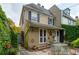 Inviting backyard patio featuring stone flooring and an elegant outdoor dining area at 21 Rutledge Ave, Charleston, SC 29401