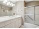 Clean bathroom with a white vanity, ample lighting, and a shower-tub combination for practical use at 21 Rutledge Ave, Charleston, SC 29401